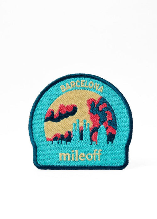 Patch with 'Barcelona' and 'mileoff' text on a white background