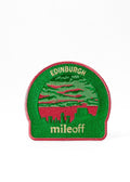 Green and red patch with 'Edinburgh mileoff' text on a white background