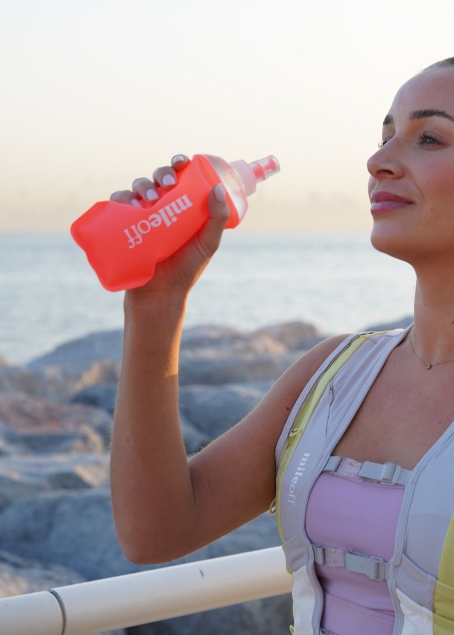 Soft squishy water flask in coral